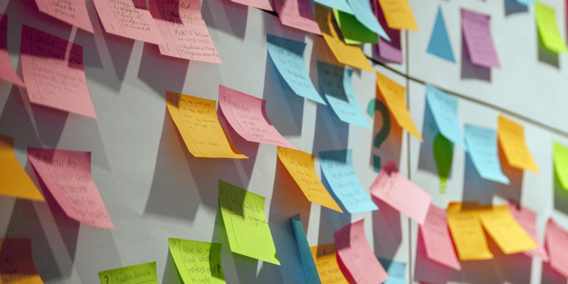 colourful post it notes on a board for preparing marketing plan