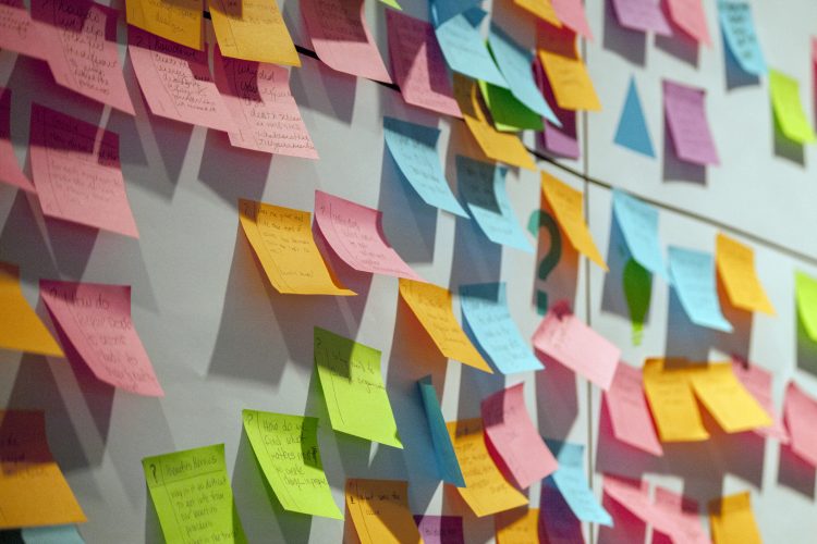 colourful post it notes on a board for preparing marketing plan