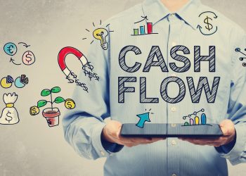 business owner holding ipad with cash flow icons floating